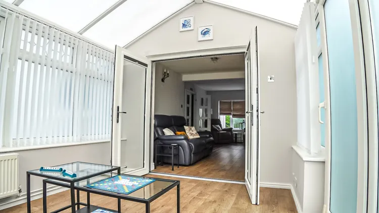 Conservatory opening onto the lounge